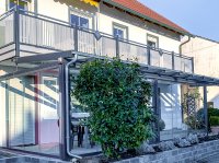 Terrassenueberdachung mit Schiebeelementen und Liba Balkon